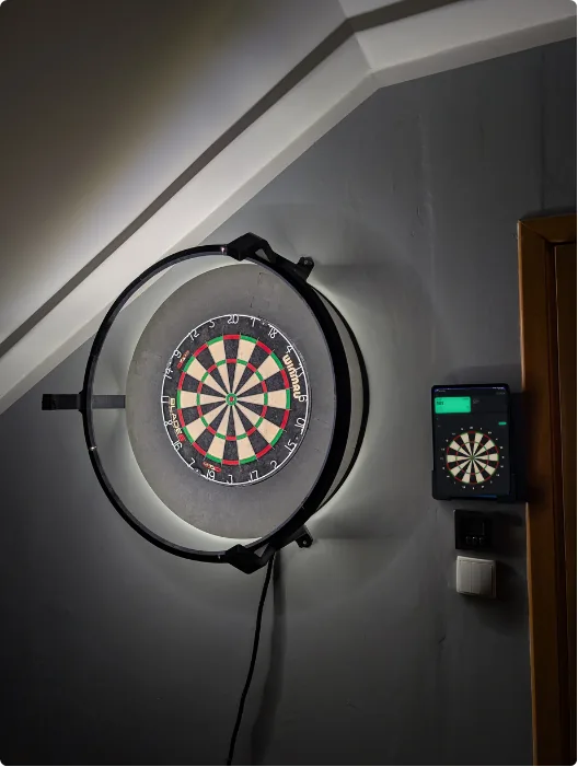 Dartboard with a DartKit camera ring and Datsu running on a nearby screen